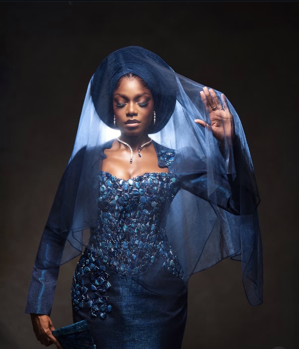 RareMagic bridal portrait in blue with a translucent veil